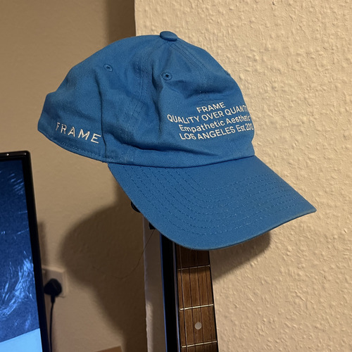 Light blue hat with text on the front