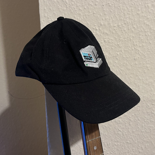 Black hat with an embroidered computer